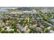 An aerial view of a community near a pond, school, and sports field at 12506 Safari Ln, Riverview, FL 33579