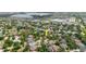Aerial shot of the property nestled within a residential area near a school and community amenities at 12506 Safari Ln, Riverview, FL 33579