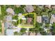 Aerial view showcasing the property's lot size, surrounded by lush greenery in a suburban neighborhood at 12506 Safari Ln, Riverview, FL 33579