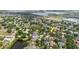 Aerial shot of the property nestled within a residential area near a school and community amenities at 12506 Safari Ln, Riverview, FL 33579