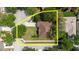 Aerial view showcasing the property's lot size, surrounded by lush greenery in a suburban neighborhood at 12506 Safari Ln, Riverview, FL 33579