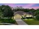 Aerial view of the property showcasing the manicured lawn, landscaping, and neighborhood at 12506 Safari Ln, Riverview, FL 33579