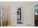 Bathroom with framed glass shower and opening to walk-in closet at 12506 Safari Ln, Riverview, FL 33579