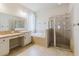 Bright bathroom with a soaking tub, separate glass-enclosed shower, and vanity area at 12506 Safari Ln, Riverview, FL 33579