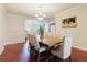 Elegant dining room with wood flooring, crown molding, a chandelier, and large wooden table at 12506 Safari Ln, Riverview, FL 33579