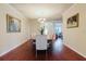 Elegant dining room with wood floors, chandelier lighting, and seating for six at 12506 Safari Ln, Riverview, FL 33579