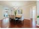 Dining room featuring wood floors, chandelier lighting, and a modern dining set at 12506 Safari Ln, Riverview, FL 33579
