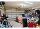 Spacious garage interior with a multi-panel door and abundant storage for equipment and bicycles at 12506 Safari Ln, Riverview, FL 33579