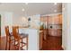 Kitchen featuring breakfast bar with seating and stainless steel appliances at 12506 Safari Ln, Riverview, FL 33579