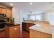 Open kitchen with granite counters, stainless appliances and adjacent living area at 12506 Safari Ln, Riverview, FL 33579