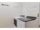 Well-organized laundry room featuring a modern washer and dryer and ample shelving for storage at 12506 Safari Ln, Riverview, FL 33579