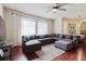 Open living room with a large sectional sofa, fan, and window views at 12506 Safari Ln, Riverview, FL 33579