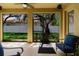 Relaxing screened porch with comfortable seating overlooking the lush backyard at 12506 Safari Ln, Riverview, FL 33579
