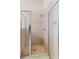 Shower stall with framed glass door and tile walls at 12506 Safari Ln, Riverview, FL 33579