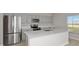 Modern kitchen with stainless steel appliances and a large center island at 13014 Wellspring Dr, Lithia, FL 33547
