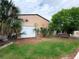 Backyard barn with a metal exterior, decorative wall art, and ample green space at 13930 King Ave, Hudson, FL 34669
