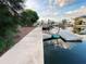 View of an old dock, walkway, and canal that offers a glimpse of the property's waterfront access at 13930 King Ave, Hudson, FL 34669