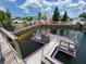 Features a private dock with easy access to the waterfront, perfect for boating and enjoying waterfront living at 13930 King Ave, Hudson, FL 34669