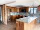 Renovated kitchen featuring custom cabinets, granite counters, and stainless steel appliances at 13930 King Ave, Hudson, FL 34669