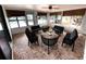 Enclosed sunroom with scenic views and ample seating at 13930 King Ave, Hudson, FL 34669