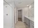 Well-lit bathroom featuring a walk-in shower, vanity with quartz countertops, and modern fixtures at 14773 Summer Branch Dr, Lithia, FL 33547