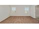 Bright bedroom with large windows and plush carpeting, perfect for relaxation at 14773 Summer Branch Dr, Lithia, FL 33547