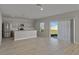Modern open-concept kitchen featuring stainless steel appliances and a central island at 14773 Summer Branch Dr, Lithia, FL 33547