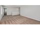 This large loft features neutral paint, carpet, and ample natural light, creating a versatile living space at 14773 Summer Branch Dr, Lithia, FL 33547