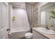 Bright bathroom featuring a tub with shower, stylish shower curtain, and modern sink vanity at 14781 Summer Branch Dr, Lithia, FL 33547