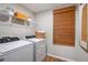 Functional laundry room with modern washer and dryer at 14781 Summer Branch Dr, Lithia, FL 33547