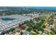 Aerial view showcases the home's location in a vibrant community near a school and other amenities at 1509 Coachlight Way, Dunedin, FL 34698