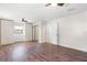 Bedroom features hardwood floors, ceiling fan, and a built-in wardrobe at 1509 Coachlight Way, Dunedin, FL 34698