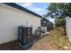 The property exterior includes the pool heater and filter system located at the rear of the home at 1509 Coachlight Way, Dunedin, FL 34698