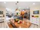 Bright, open kitchen featuring stainless steel appliances, a spacious island, and a dining area with natural light at 1509 Coachlight Way, Dunedin, FL 34698