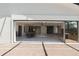 Expansive living area seamlessly connecting to the outdoors, featuring tile flooring and great natural light at 1509 Coachlight Way, Dunedin, FL 34698