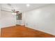 Living room featuring hardwood floors and natural lighting at 1509 Coachlight Way, Dunedin, FL 34698