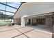Expansive outdoor patio with seamless transition to the indoor living space and screened in pool at 1509 Coachlight Way, Dunedin, FL 34698
