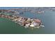 Scenic aerial view of waterfront homes, each with private docks, nestled in a charming coastal community at 16496 Redington Dr, Redington Beach, FL 33708