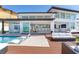 Backyard features an outdoor living space with a pool, deck, and water views at 16496 Redington Dr, Redington Beach, FL 33708