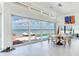A bright dining area with views of the pool and waterfront featuring a modern table set at 16496 Redington Dr, Redington Beach, FL 33708