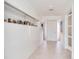 Bright hallway with built-in display cabinets and artwork at 16496 Redington Dr, Redington Beach, FL 33708