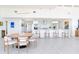 Open concept kitchen and dining area featuring modern design and stainless steel appliances at 16496 Redington Dr, Redington Beach, FL 33708