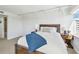 Bright and airy bedroom with a comfortable queen bed, neutral carpet and a view of the city at 1750 Benjamin Franklin Dr # 11G, Sarasota, FL 34236