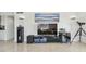 Modern entertainment center with sleek black cabinetry and stylish decor at 1750 Benjamin Franklin Dr # 11G, Sarasota, FL 34236