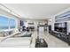 Expansive living space featuring modern decor, an open layout, and a beautiful ocean view at 1750 Benjamin Franklin Dr # 11G, Sarasota, FL 34236
