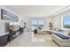 Bright and spacious living room featuring comfortable seating and a stunning ocean view at 1750 Benjamin Franklin Dr # 11G, Sarasota, FL 34236
