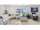 Bright and airy living room with stylish decor and a comfortable seating arrangement at 1750 Benjamin Franklin Dr # 11G, Sarasota, FL 34236