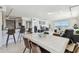 Open-concept living space combining kitchen, dining, and living area, with a bright ocean view at 1750 Benjamin Franklin Dr # 11G, Sarasota, FL 34236