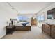 Spacious main bedroom with a comfortable king-size bed, a view of the city and neutral walls at 1750 Benjamin Franklin Dr # 11G, Sarasota, FL 34236