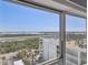 Breathtaking waterfront view of the bay and buildings seen from the window at 1750 Benjamin Franklin Dr # 11G, Sarasota, FL 34236